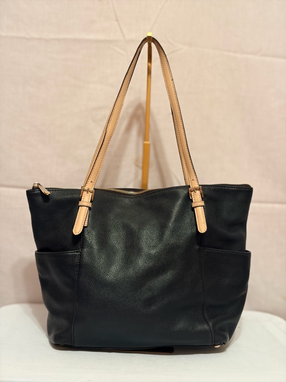 Michael Kors black leather Indio strap shoulder bag, antique brass hardware.
